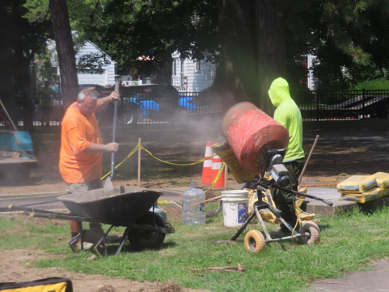 Commercial Parking Lot Paving project in Springfield, MA — workers mixing concrete