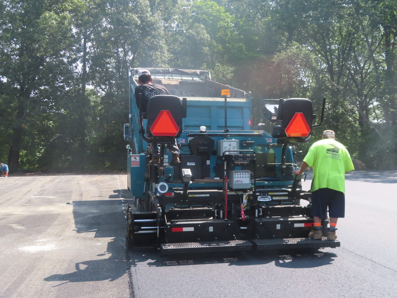 Commercial Parking Lot Paving project in Springfield, MA — paver from rear laying mat