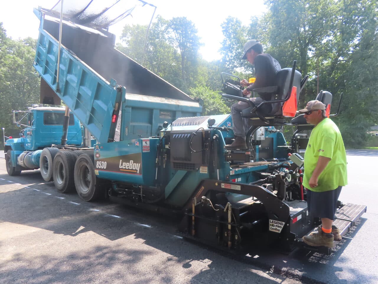 Commercial Parking Lot Paving project in Springfield, MA — paver loading from dump truck
