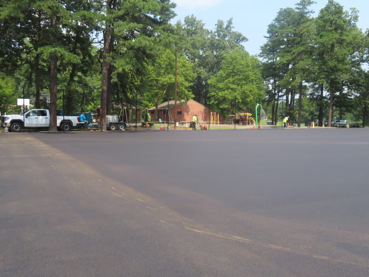 Commercial Parking Lot Paving project in Springfield, MA — finished asphalt lot near playground