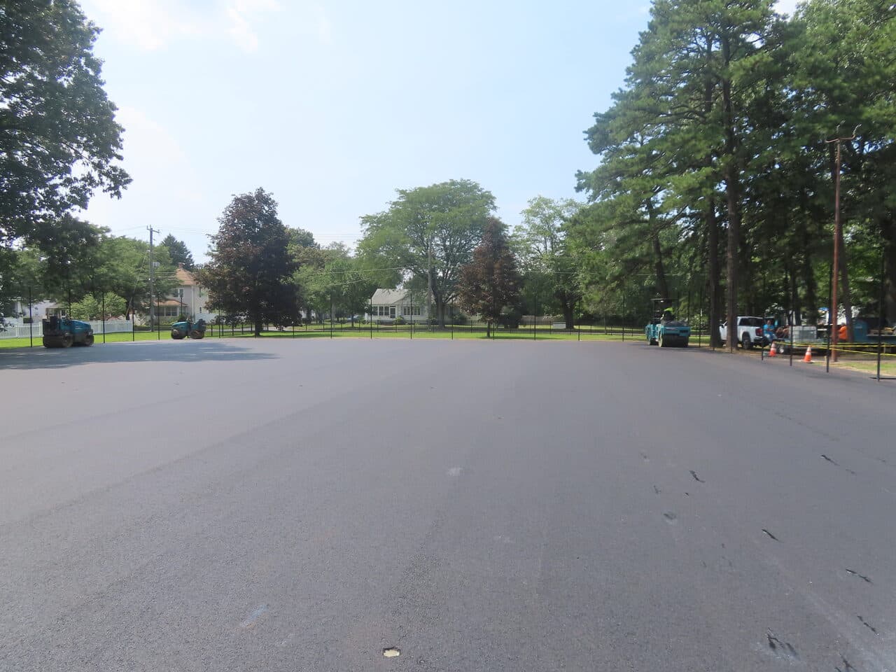 Commercial Parking Lot Paving project in Springfield, MA — wide finished parking lot residential backdrop