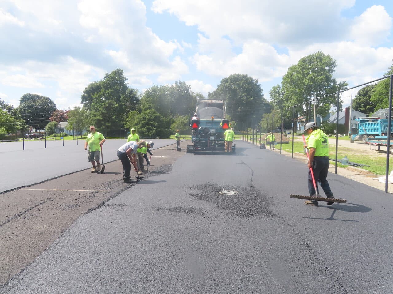 Commercial Parking Lot Paving project in Barrington, RI — crew finishing fresh asphalt