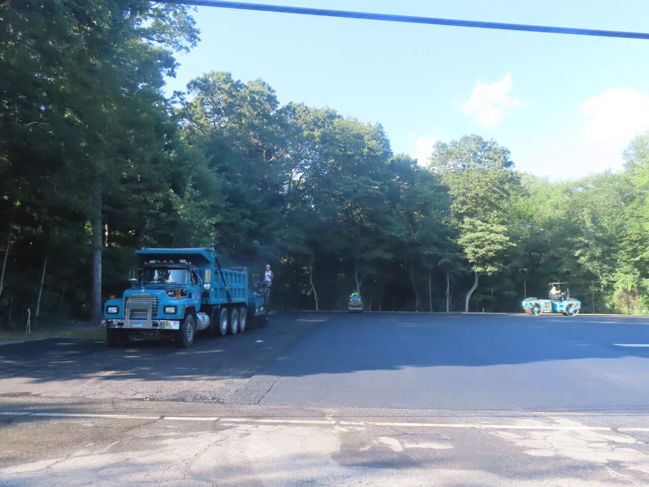 Commercial Parking Lot Paving project in Barrington, RI — dump truck and rollers staged
