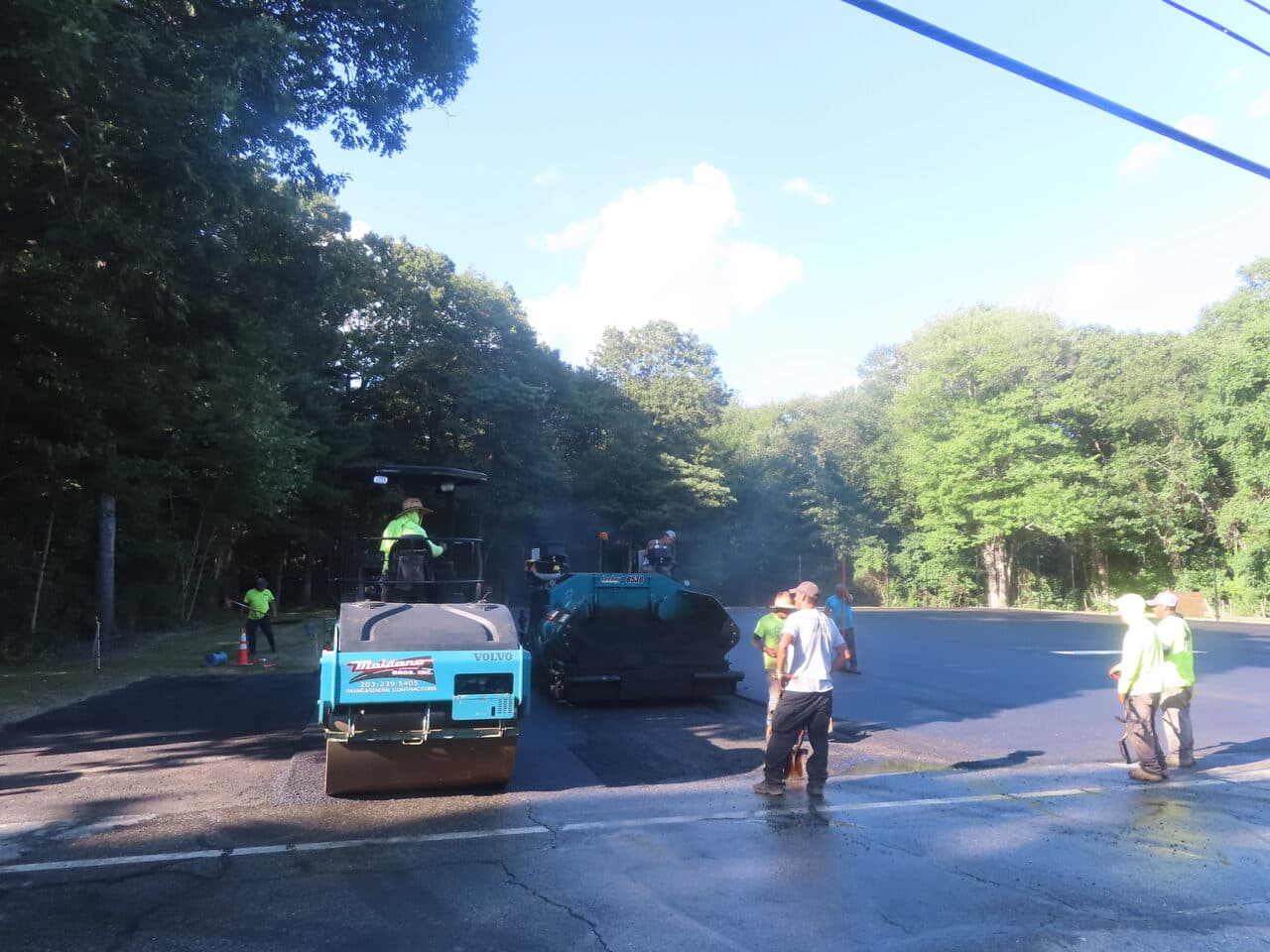 Commercial Parking Lot Paving project in Barrington, RI — branded roller paving with crew