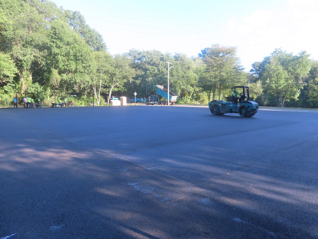 Commercial Parking Lot Paving project in Barrington, RI — finished lot roller golden light