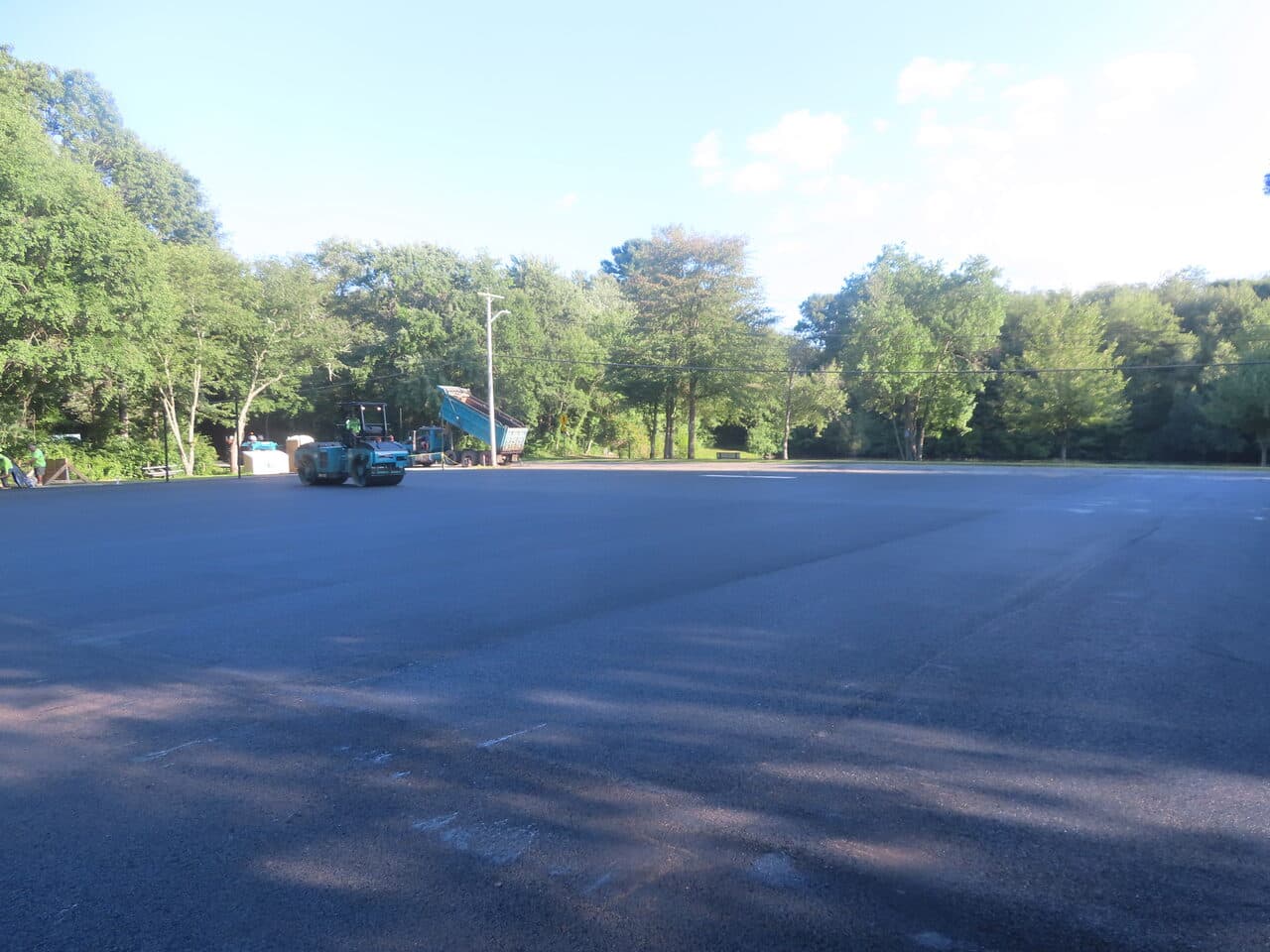 Commercial Parking Lot Paving project in Barrington, RI — wide finished lot evening light