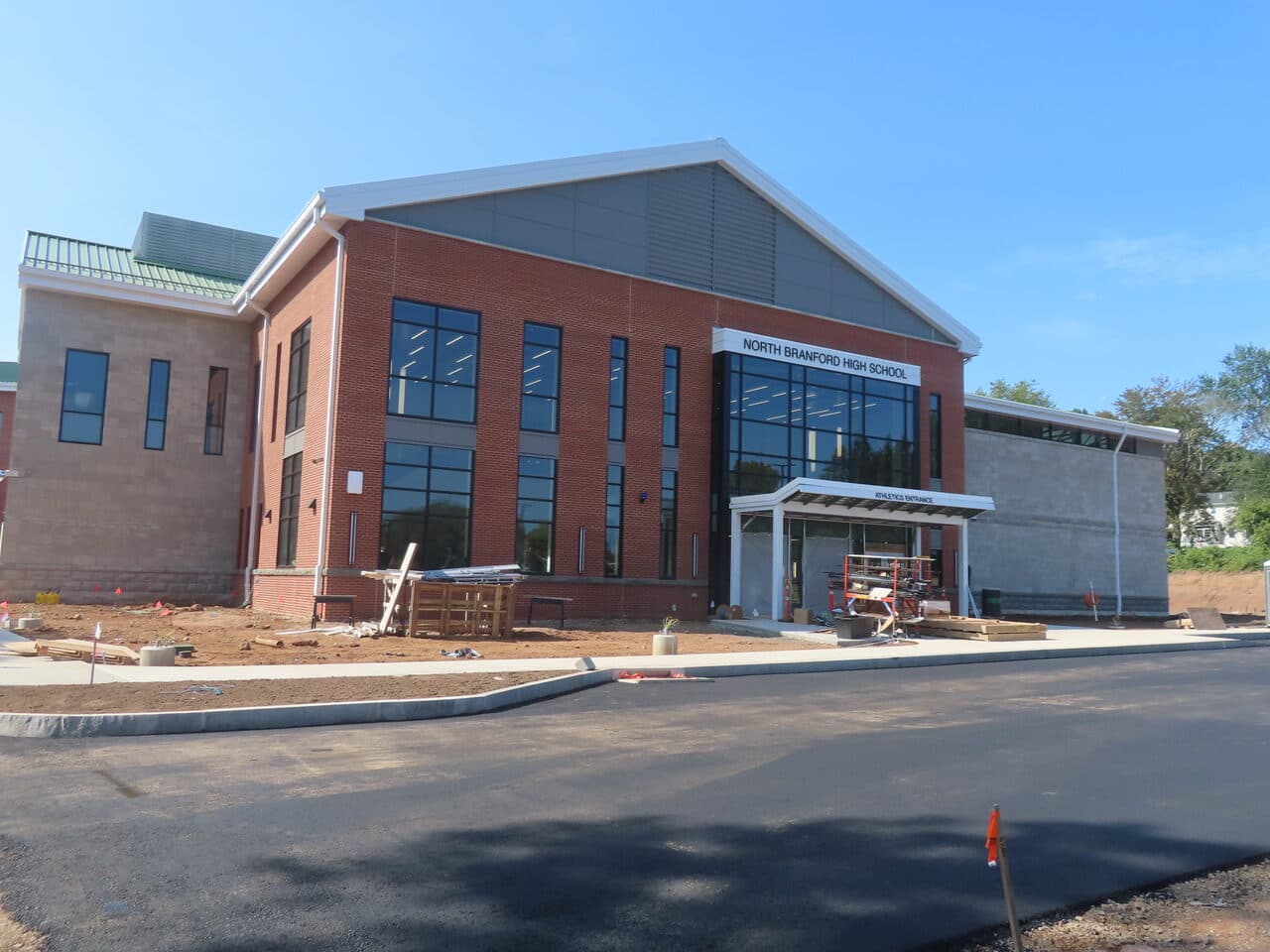 Commercial Parking Lot Paving project in North Branford, CT — North Branford High School building fresh asphalt