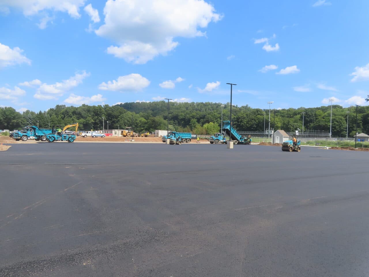 Before — Commercial Parking Lot Paving in North Branford, CT (fresh paved lot with paving crew)