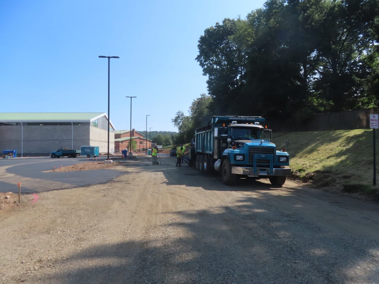 Before — Commercial Parking Lot Paving in North Branford, CT (gravel drive before paving with dump truck)