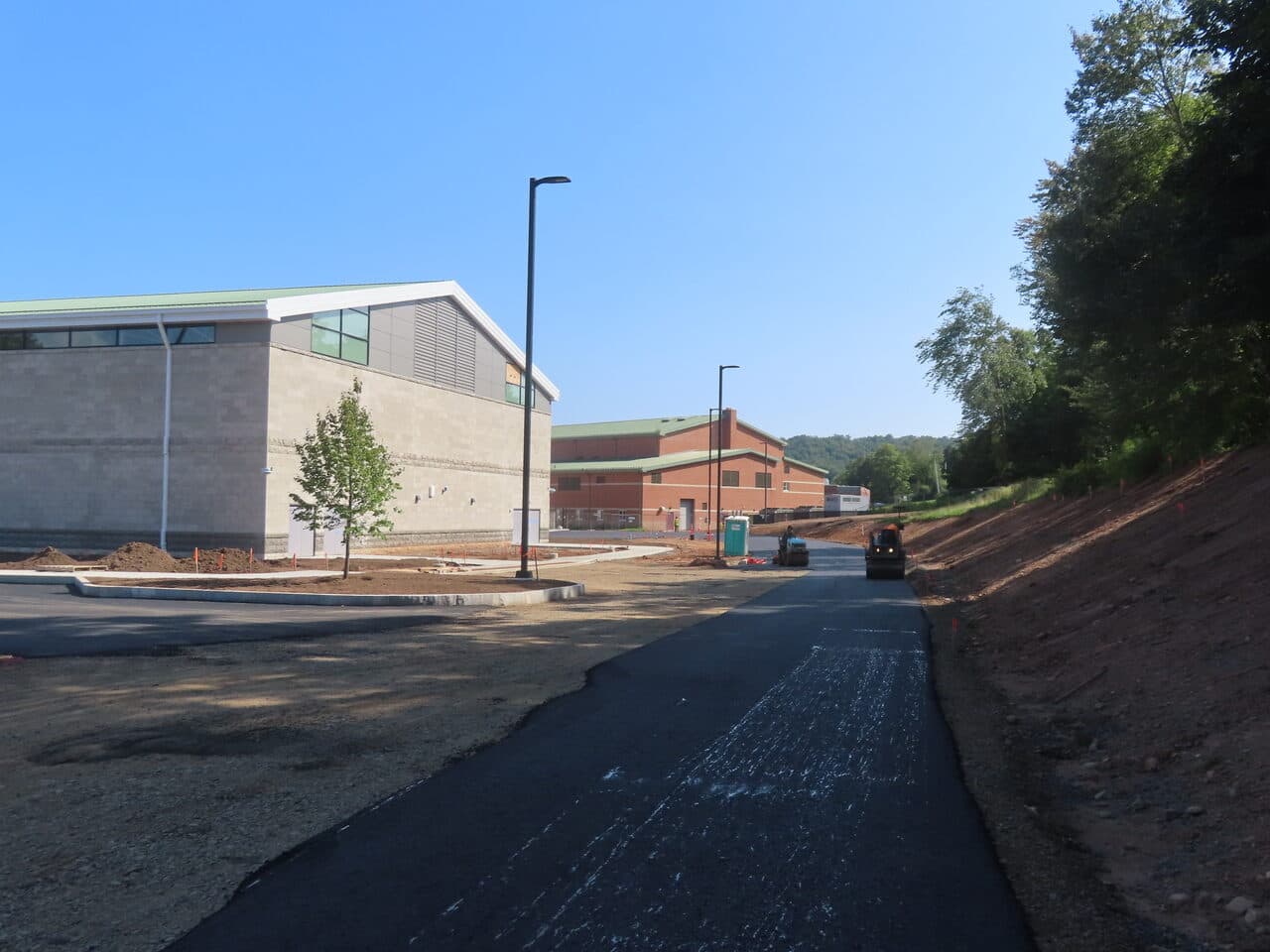 After — Commercial Parking Lot Paving in North Branford, CT (gravel drive before paving with dump truck)