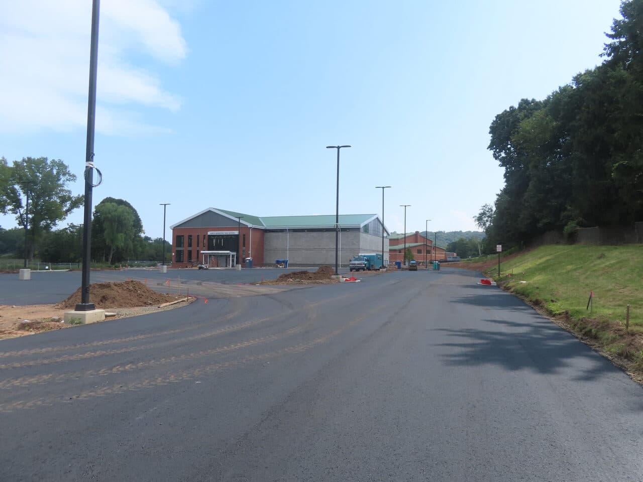 Commercial Parking Lot Paving project in North Branford, CT — finished asphalt drive toward school