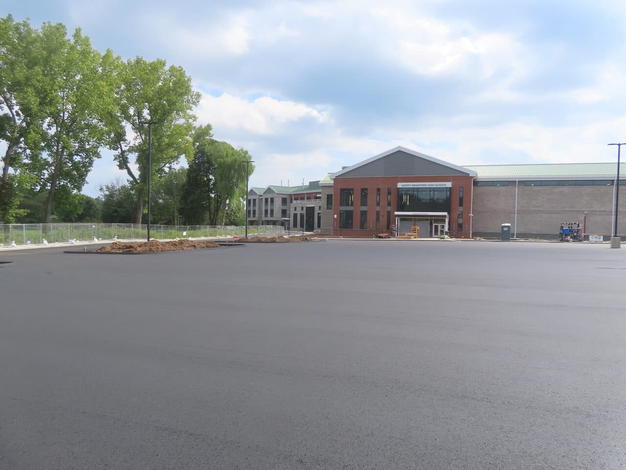 Commercial Parking Lot Paving project in North Branford, CT — finished parking lot by school building