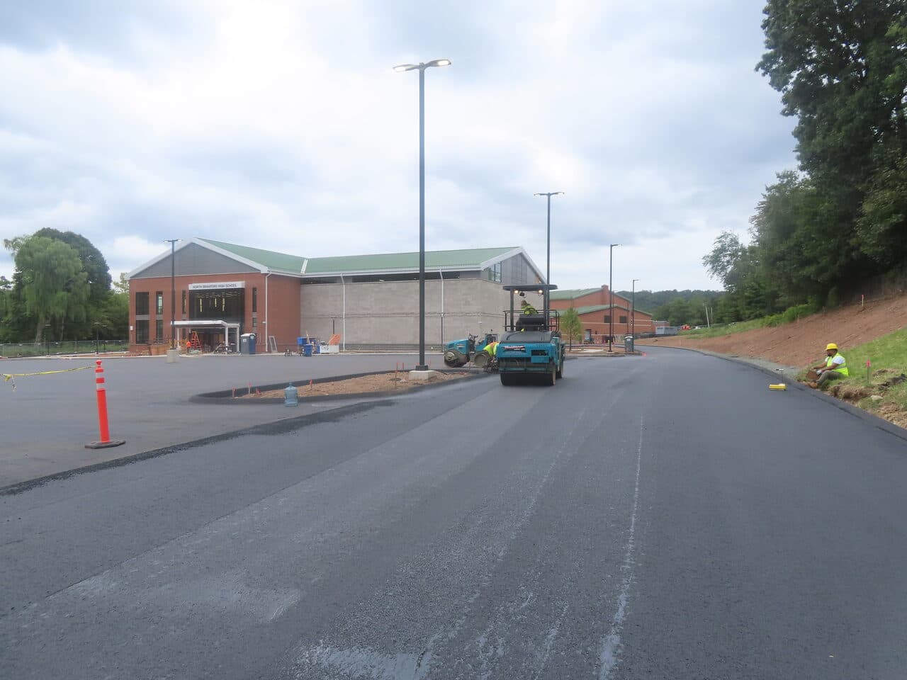 Commercial Parking Lot Paving project in North Branford, CT — roller paving road by school
