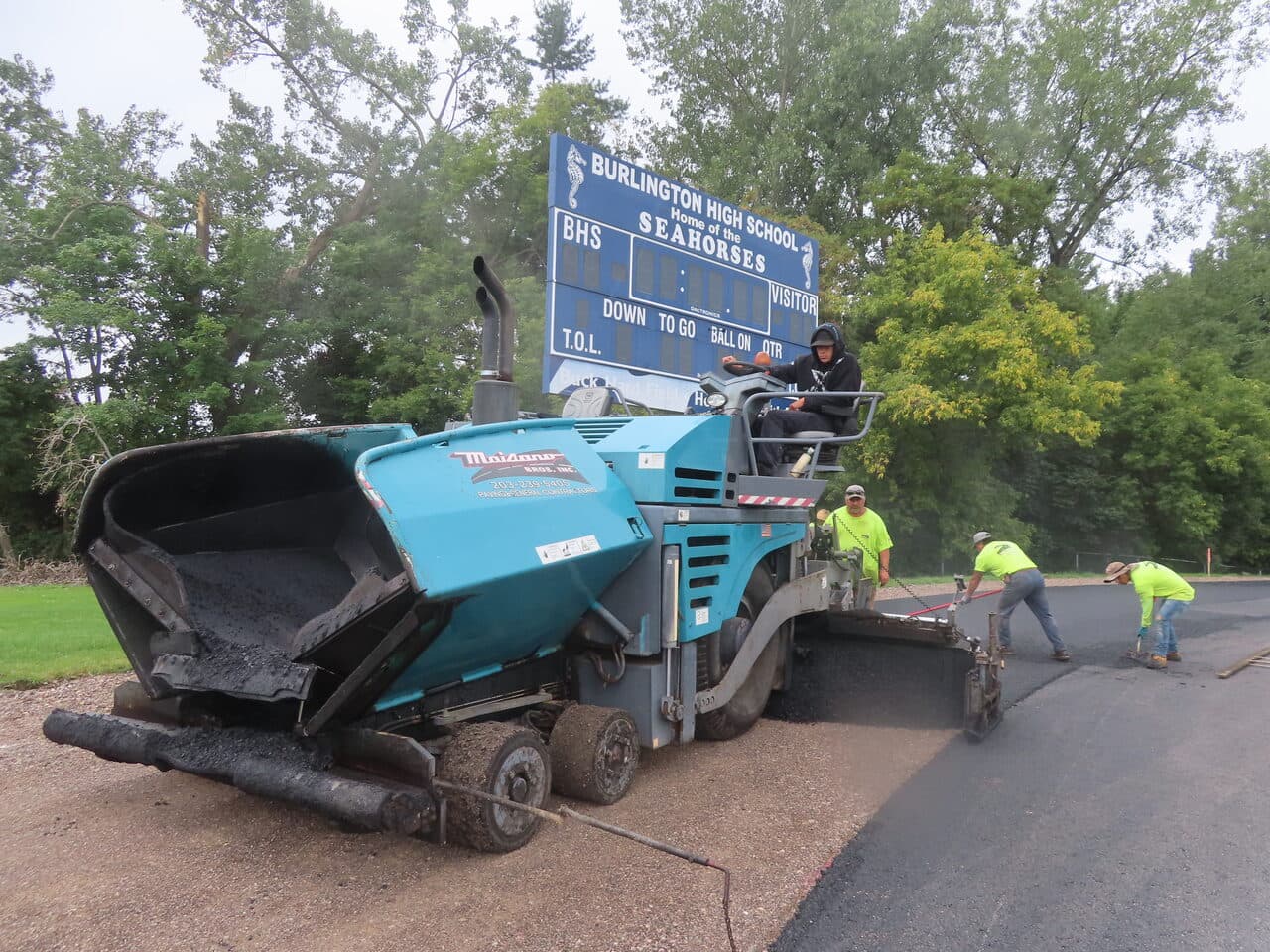 Athletic Surface Base Paving project in Burlington, VT — paver under Burlington High scoreboard