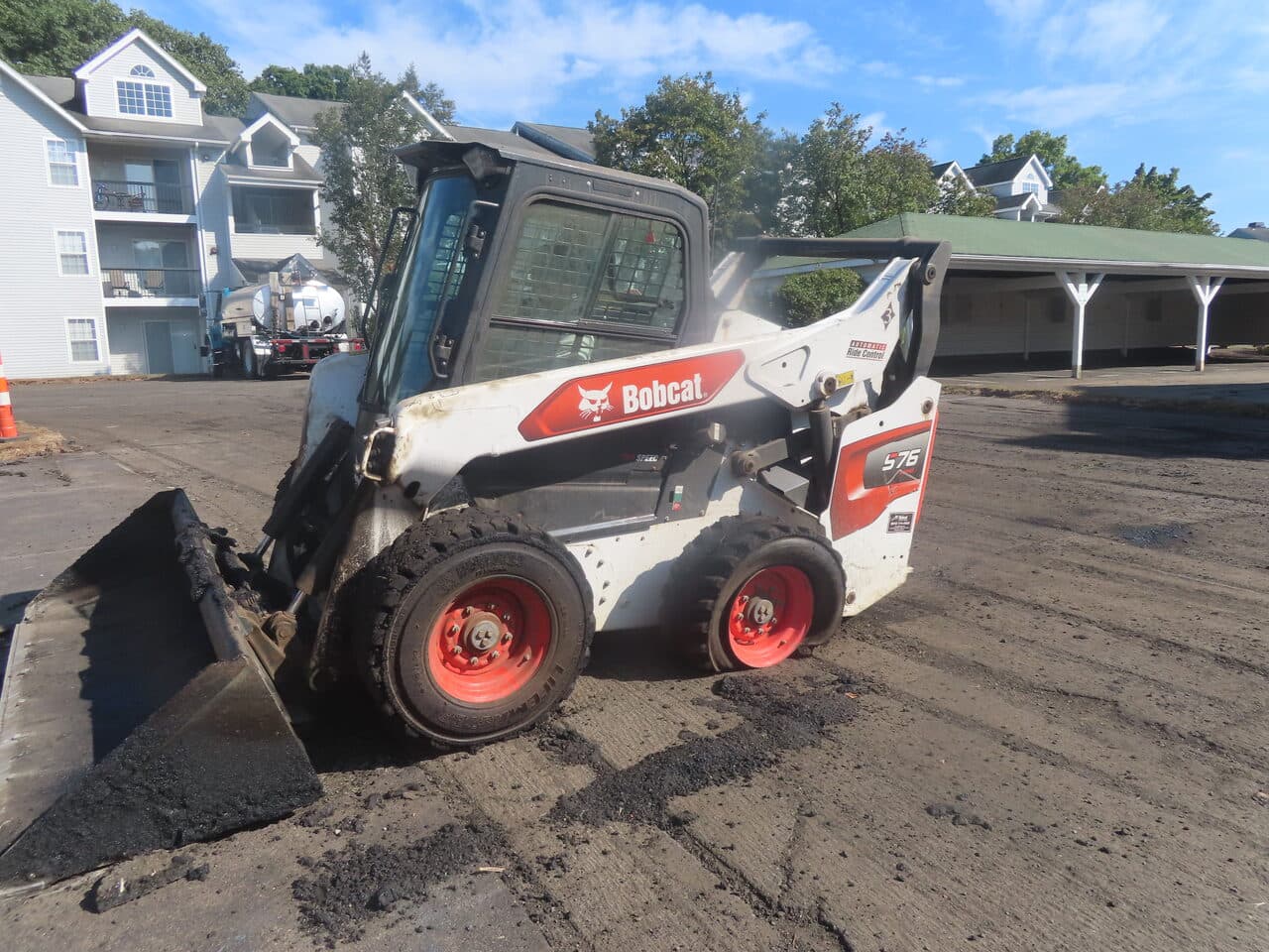 HOA Parking Lot Paving project in Hamden, CT — Bobcat skid steer on prepped lot