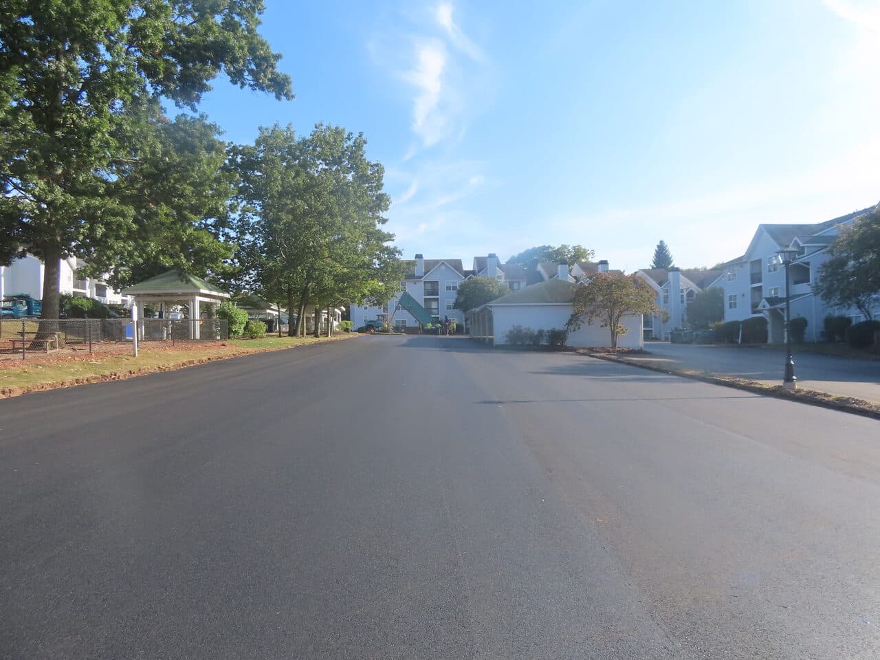 HOA Parking Lot Paving project in Hamden, CT — finished asphalt road at complex