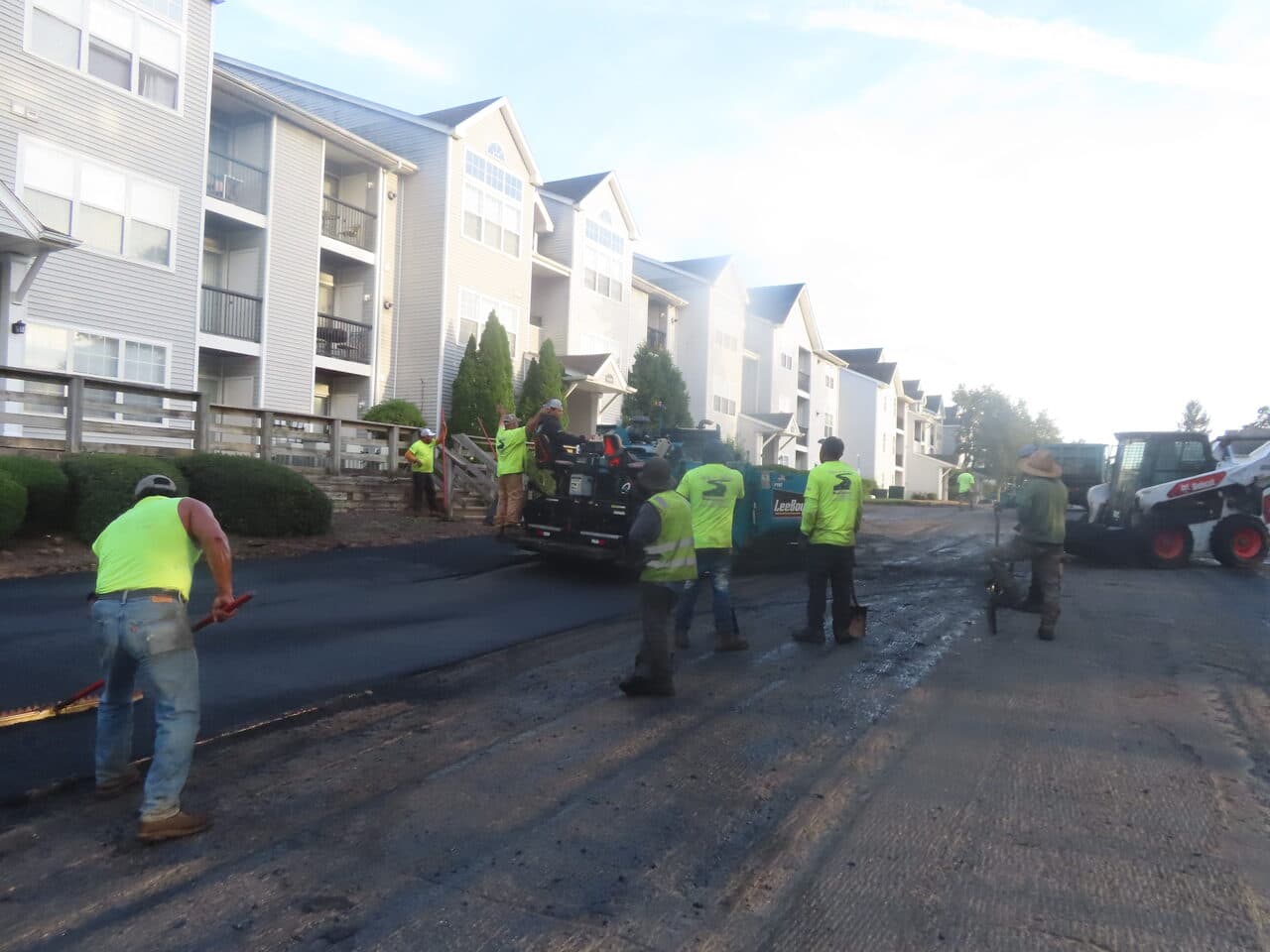 HOA Parking Lot Paving project in Hamden, CT — crew paving new mat
