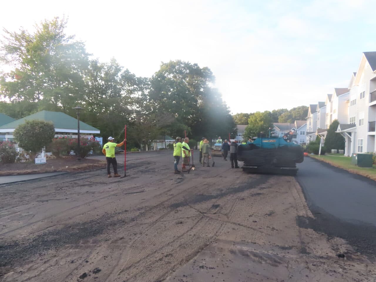 HOA Parking Lot Paving project in Hamden, CT — crew paving milled surface