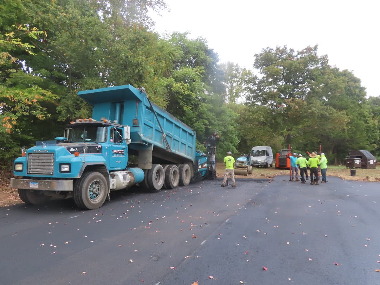 Commercial Parking Lot Paving project in Branford, CT — blue dump truck on paved lot