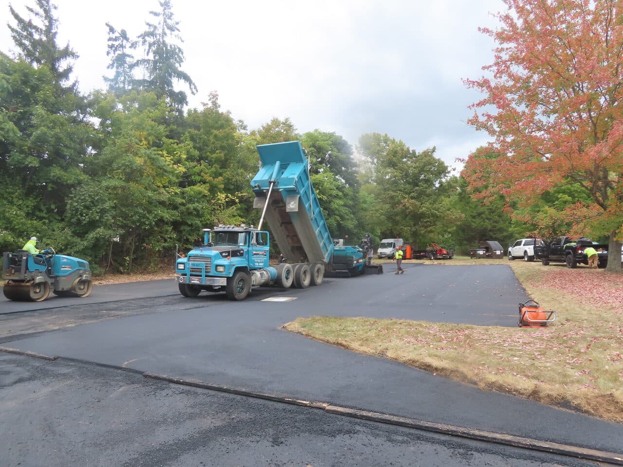 Commercial Parking Lot Paving project in Branford, CT — paving crew with roller and truck