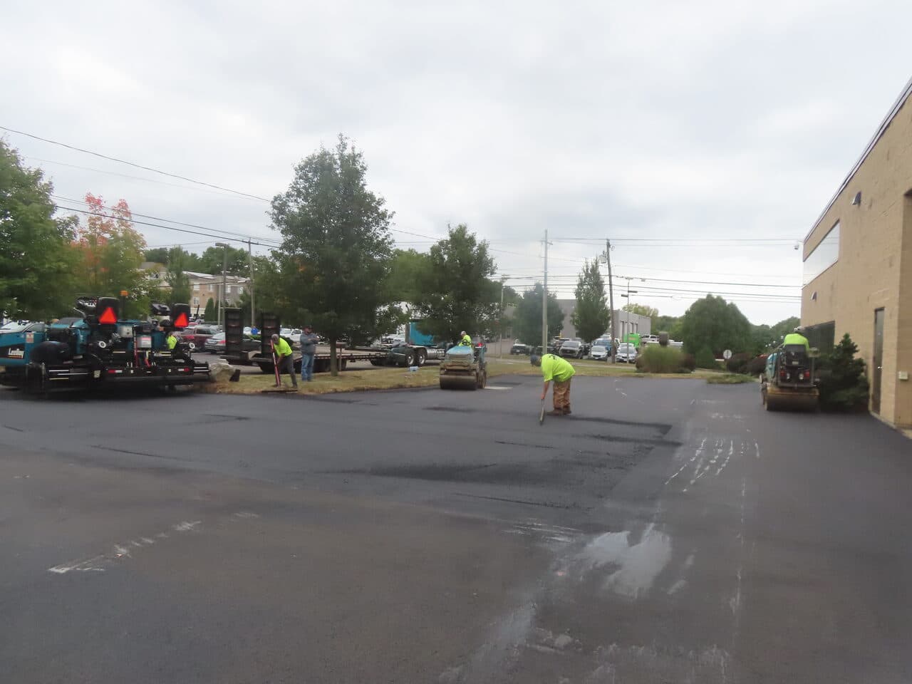 Commercial Parking Lot Paving project in Branford, CT — fresh asphalt parking lot being paved
