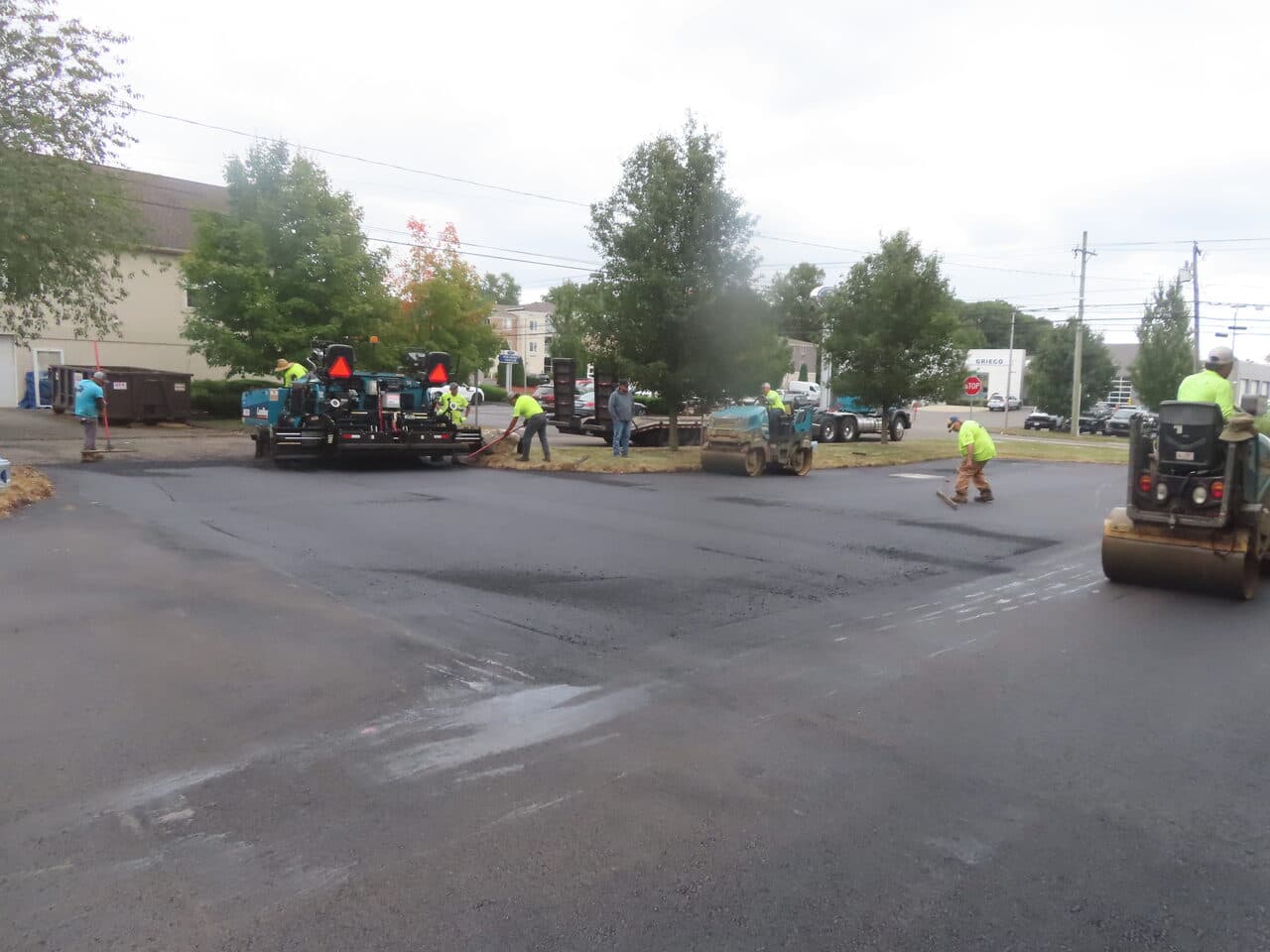Commercial Parking Lot Paving project in Branford, CT — crew rolling new asphalt lot
