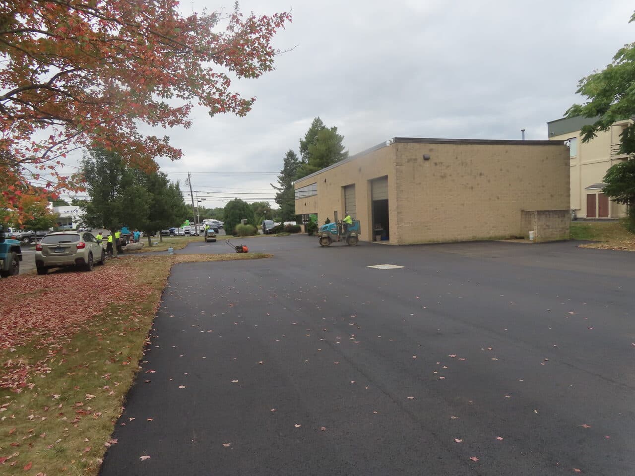 Commercial Parking Lot Paving project in Branford, CT — new asphalt drive beside commercial building
