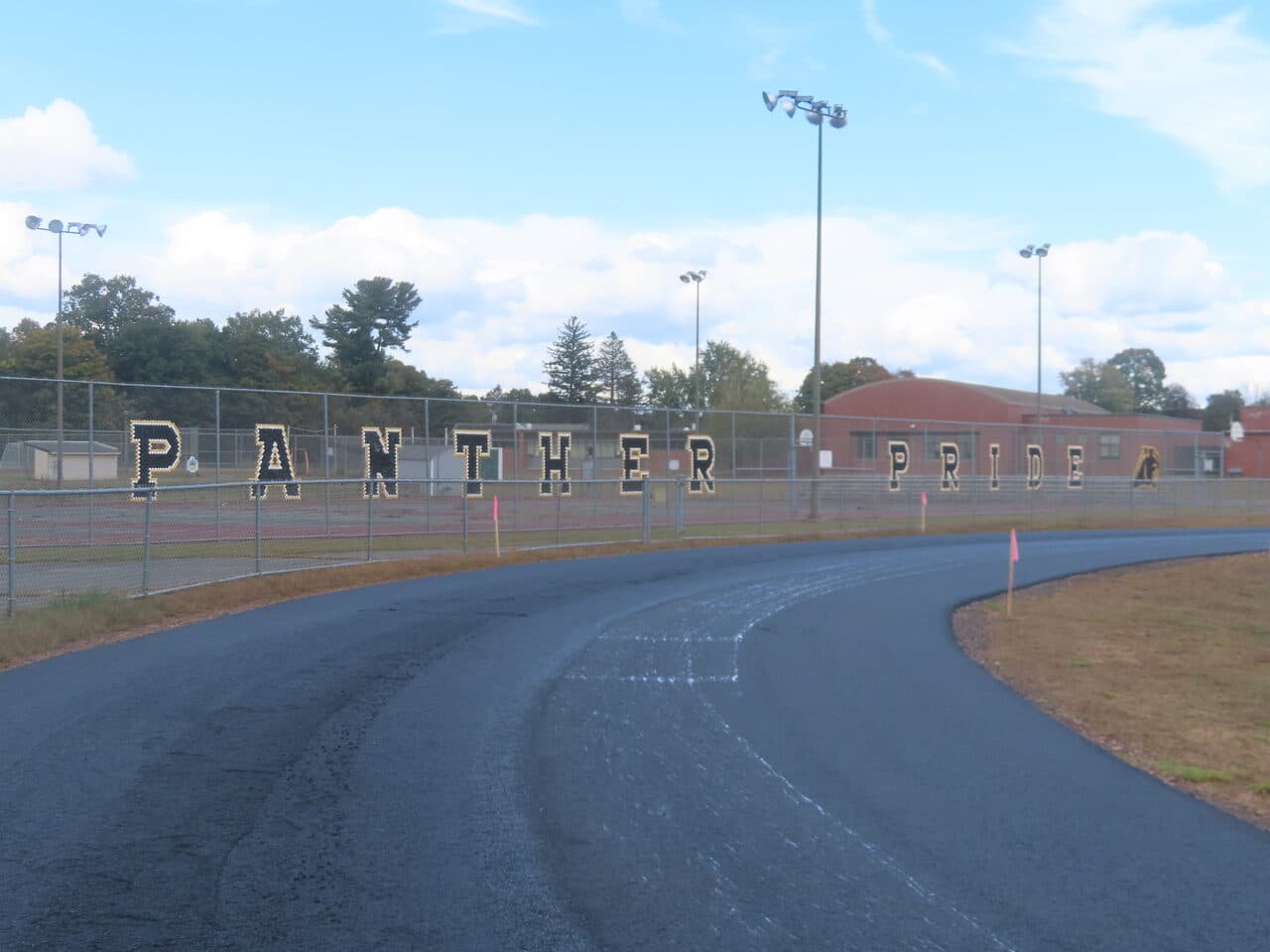 Athletic Surface Base Paving project in East Windsor, CT — finished asphalt track Panther Pride