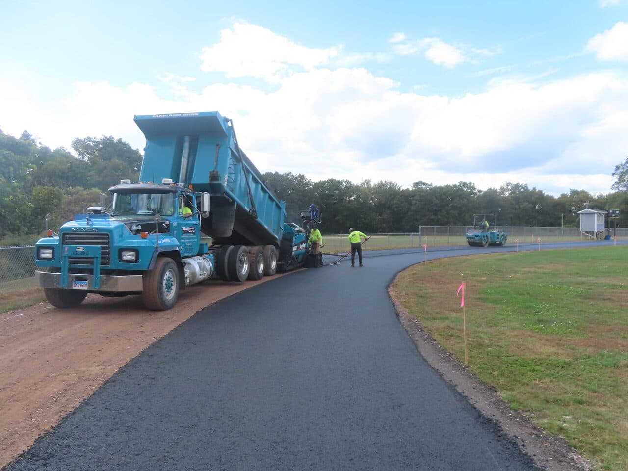 Athletic Surface Base Paving project in East Windsor, CT — Maisano truck on new access road
