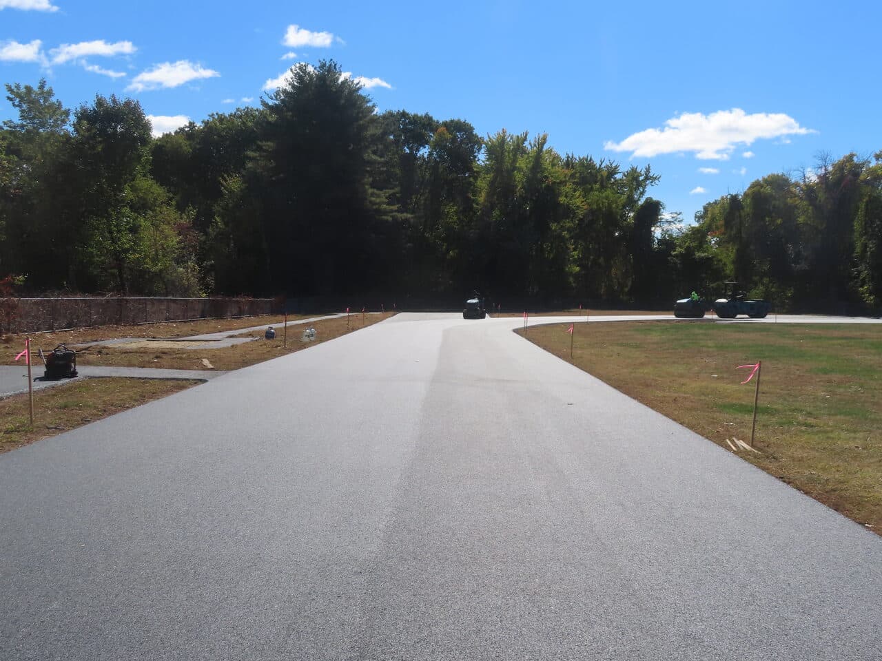Athletic Surface Base Paving project in East Windsor, CT — finished paved path through trees