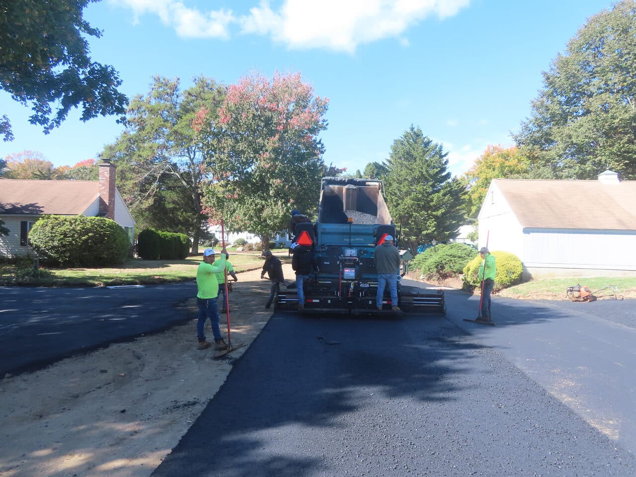 Roadway Paving project in Madison, CT — paver laying asphalt on roadway