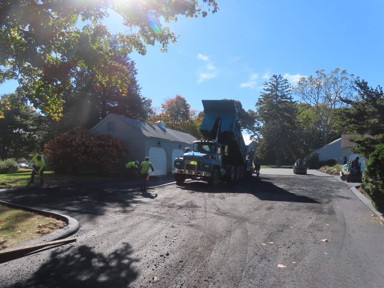 Roadway Paving project in Madison, CT — fresh asphalt paving on private road