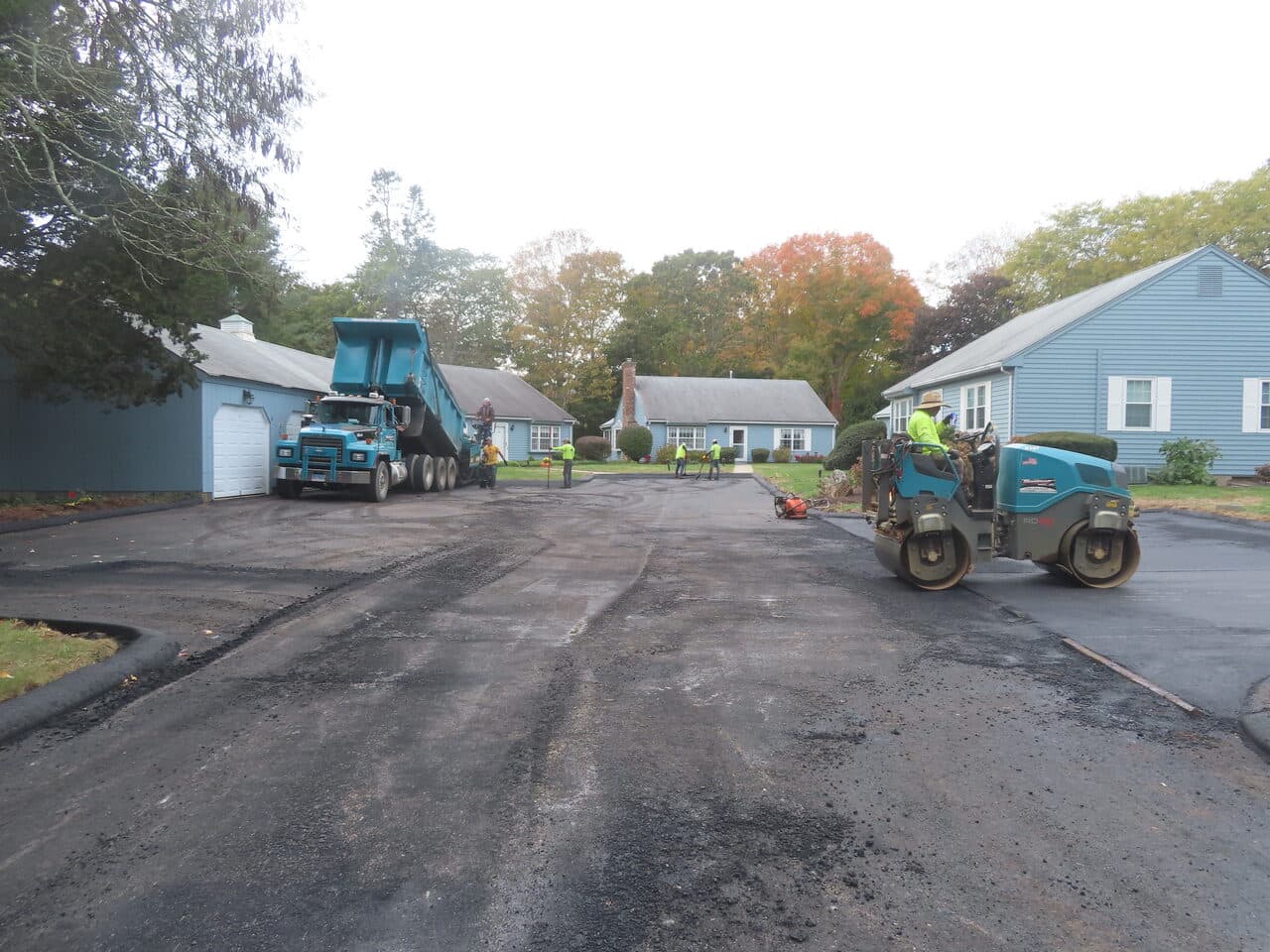 Roadway Paving project in Madison, CT — paving crew milled road before paving
