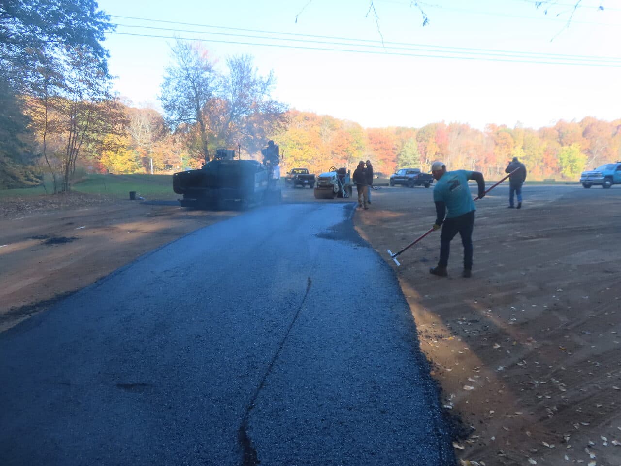 Roadway Paving project in Wallingford, CT — fresh asphalt road paving in progress