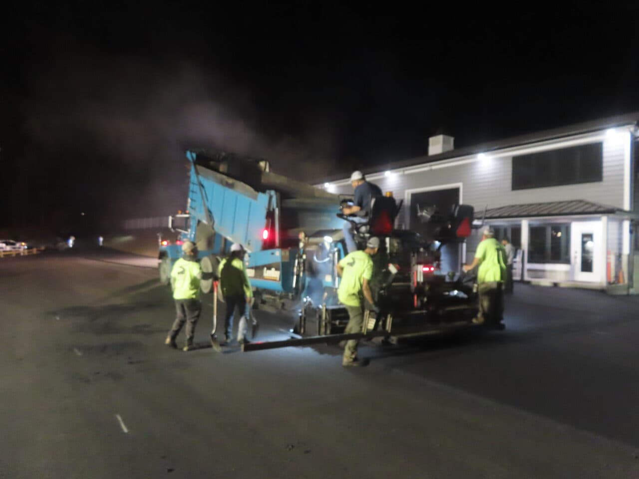 Roadway Paving project in Wallingford, CT — night crew running paver at clubhouse