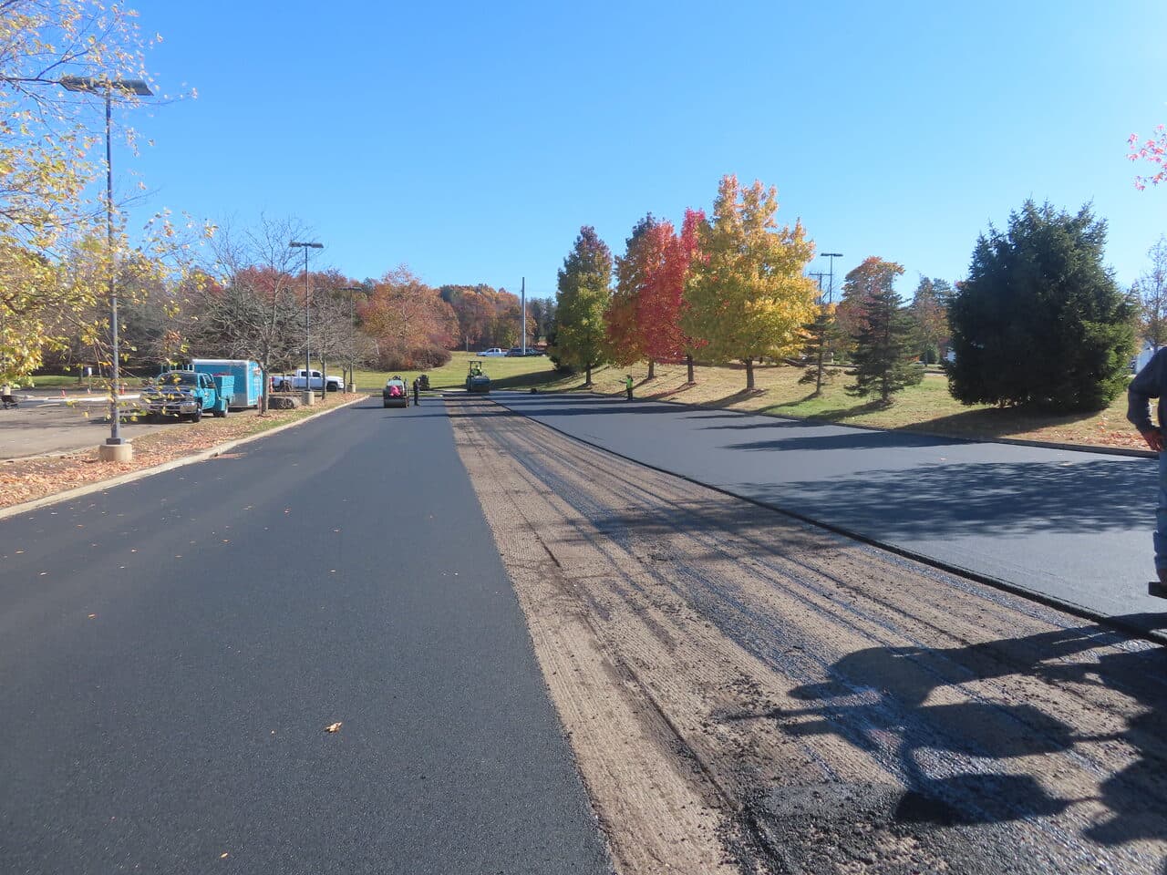 Commercial Parking Lot Paving project in South Windsor, CT — fresh asphalt overlay on access road