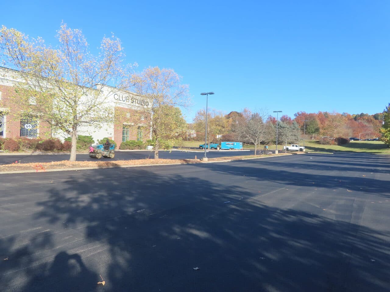 Commercial Parking Lot Paving project in South Windsor, CT — broad finished lot with fall foliage
