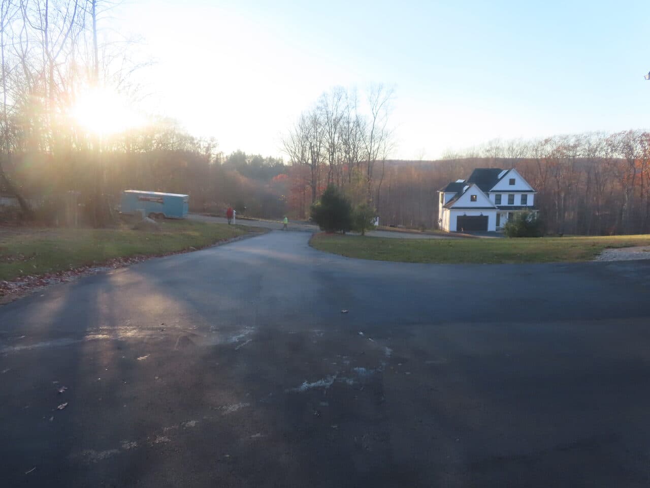 Residential Driveway Paving project in Middletown, CT — wide paved turnaround with house