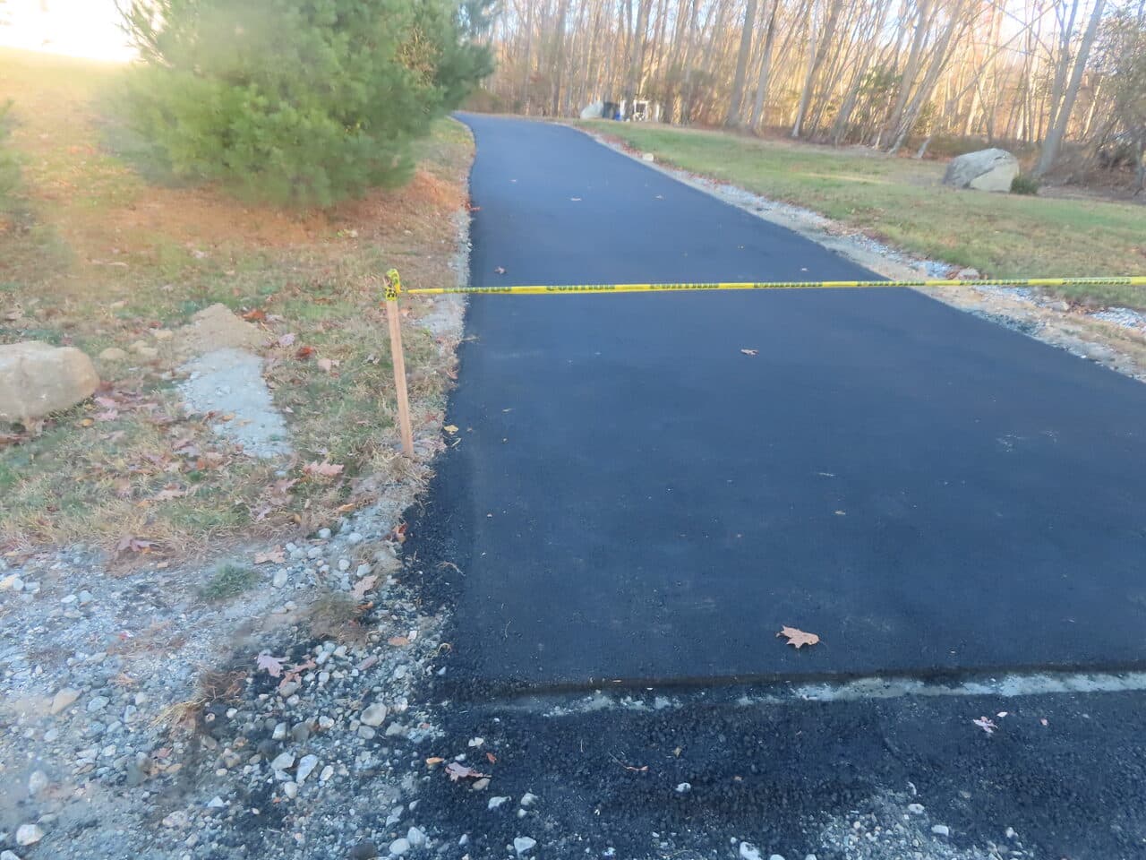 Residential Driveway Paving project in Middletown, CT — fresh driveway with caution tape