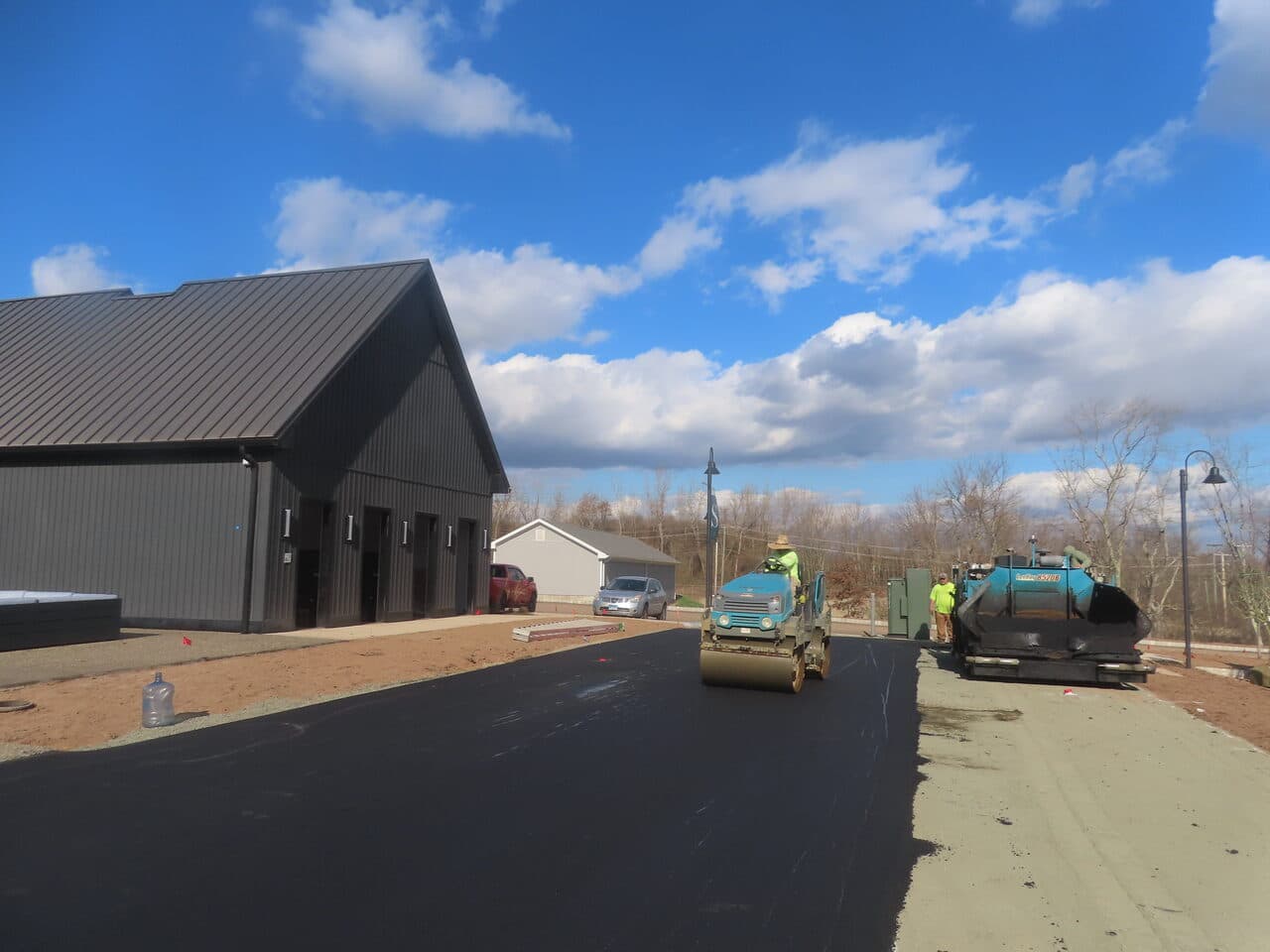 Commercial Apartment Complex Parking Lot Paving project in Middletown, CT — paver and roller laying commercial lot