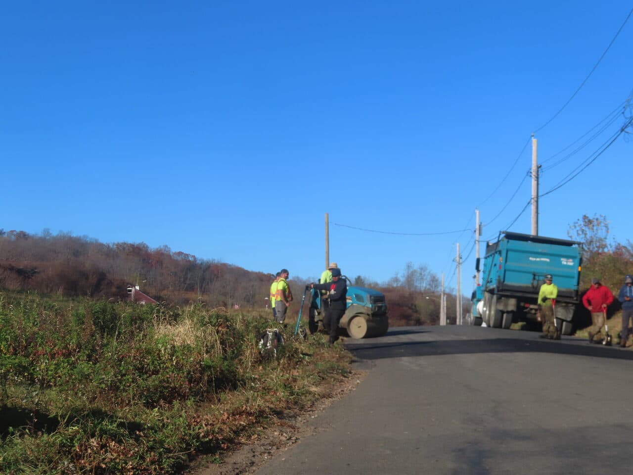 Roadway Paving project in Northford, CT — crew with roller and dump truck