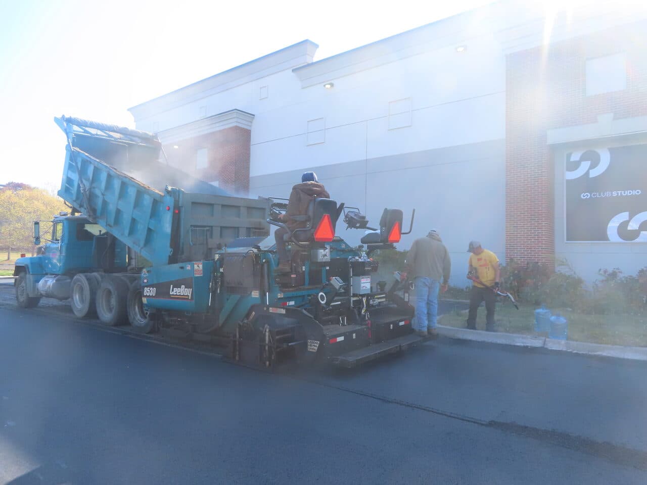 Commercial Parking Lot Paving project in South Windsor, CT — LeeBoy paver laying asphalt
