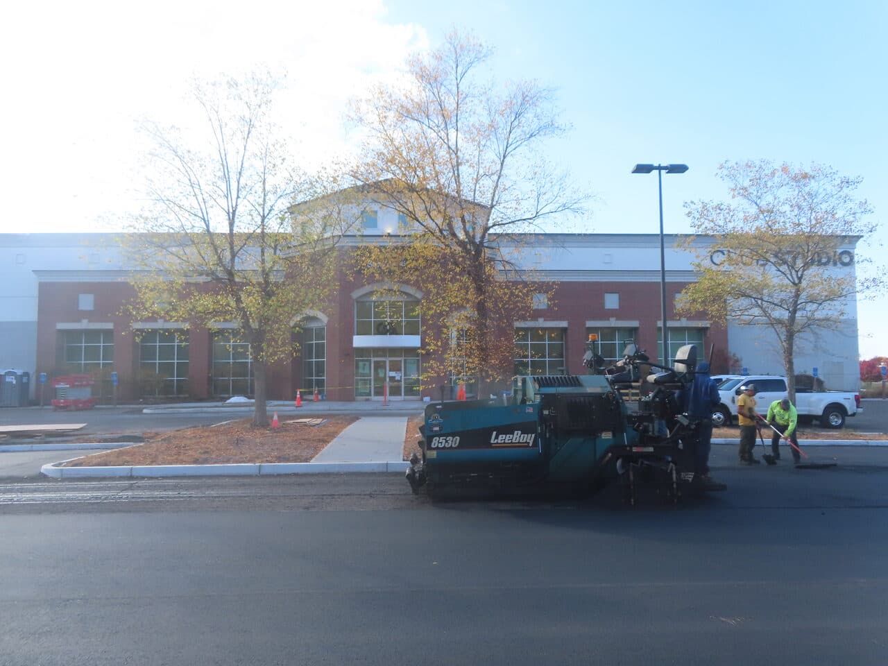 Commercial Parking Lot Paving project in South Windsor, CT — paver in front of Club Studio