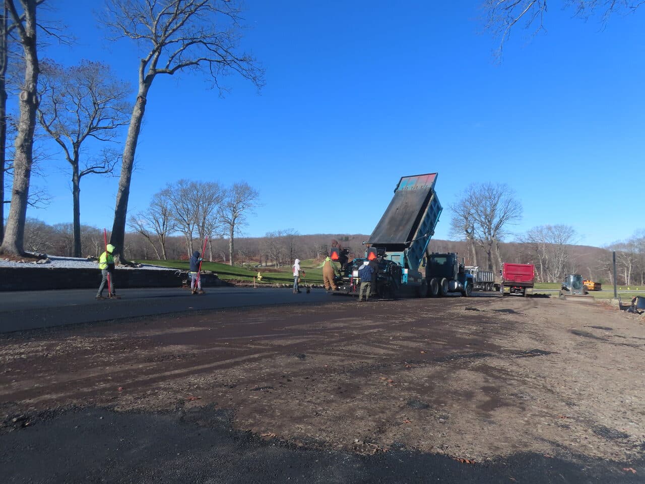 Golf Course Paving project in New Haven, CT — crew raking fresh asphalt