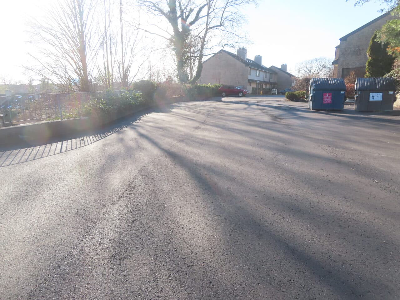 HOA & Condo Roadway Paving project in Stamford, CT — finished HOA road with dumpsters
