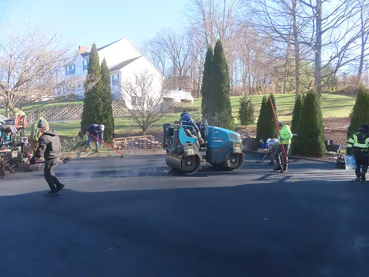 Maisano Bros. Inc. paving driveway during a cold day in Wallingford, CT