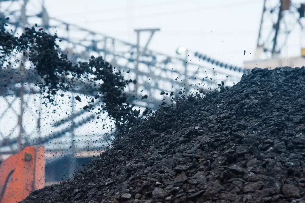 Recycled asphalt pavement being processed at a milling facility
