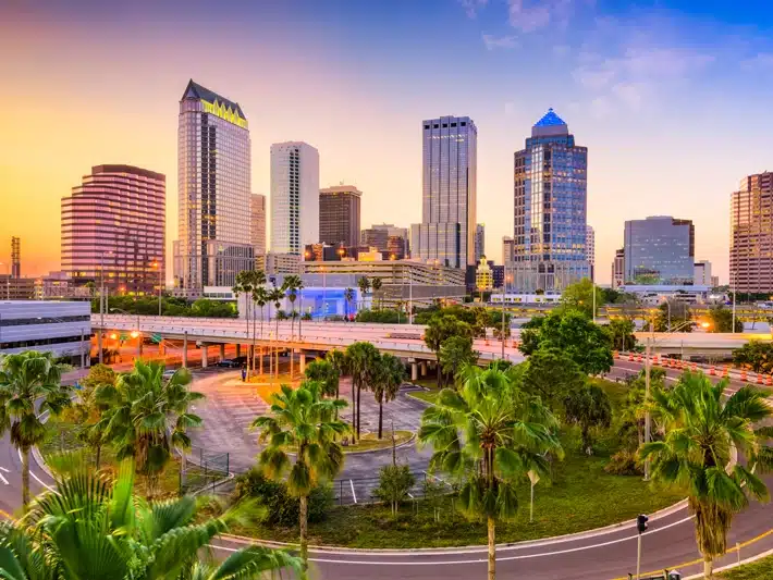 Tampa parking lot paving crew placing HMA with steel and pneumatic rollers for target compaction