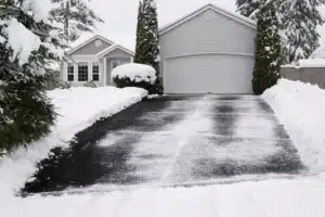 Residential heated driveway melting snow after a winter storm.