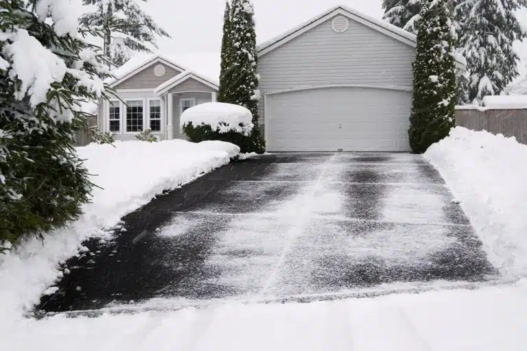 Residential heated driveway melting snow after a winter storm.